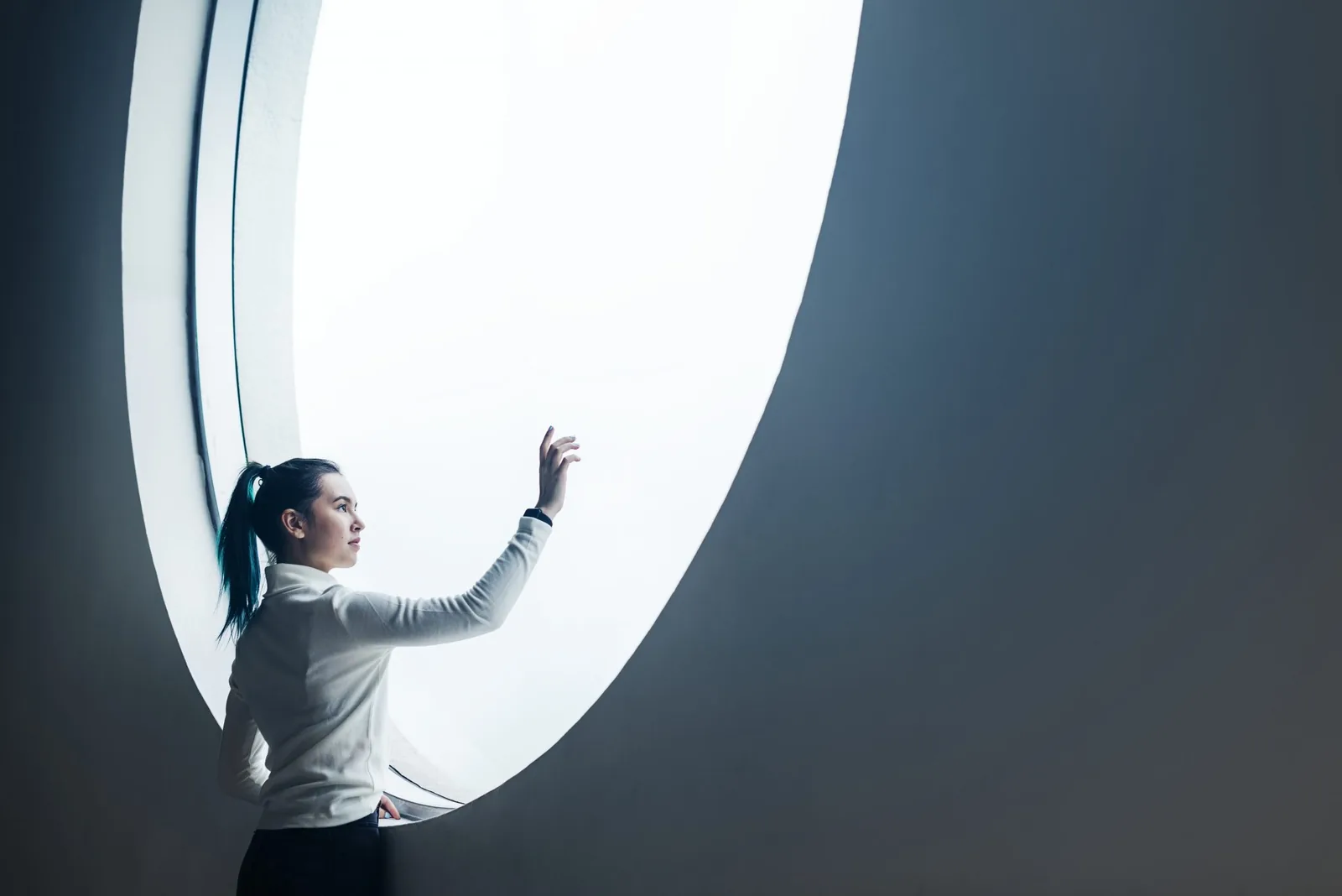 Agentur Girl using touch screen in a modern smart home